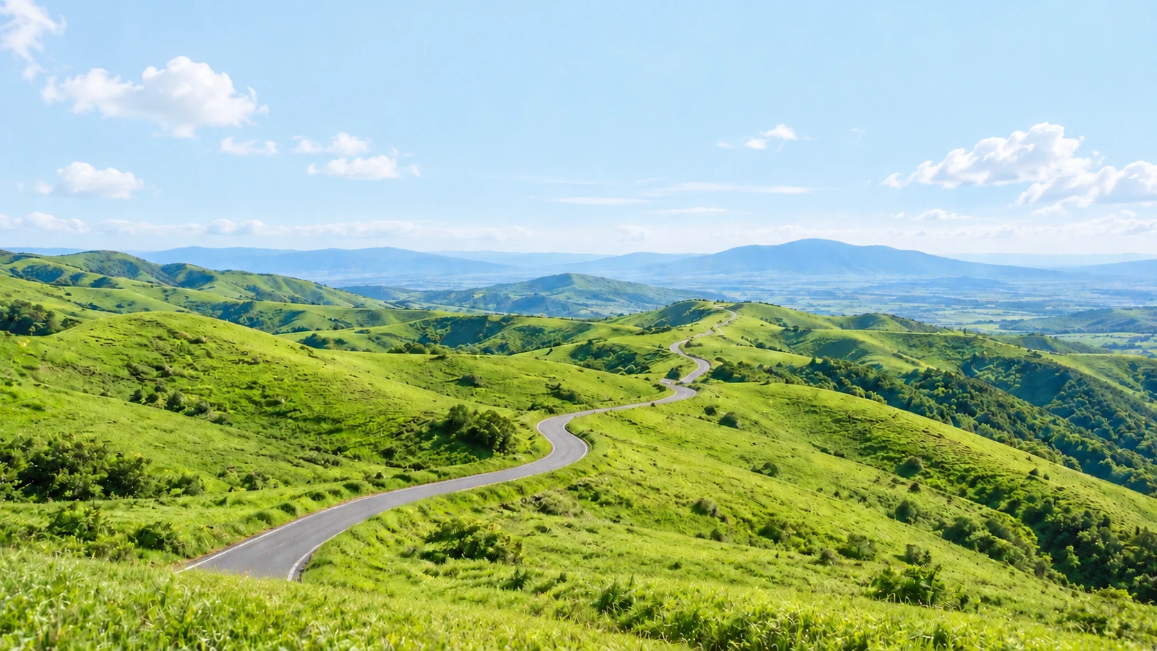 阿蘇をイメージした、青空と緑の丘に曲がりくねった道が続く生成風景